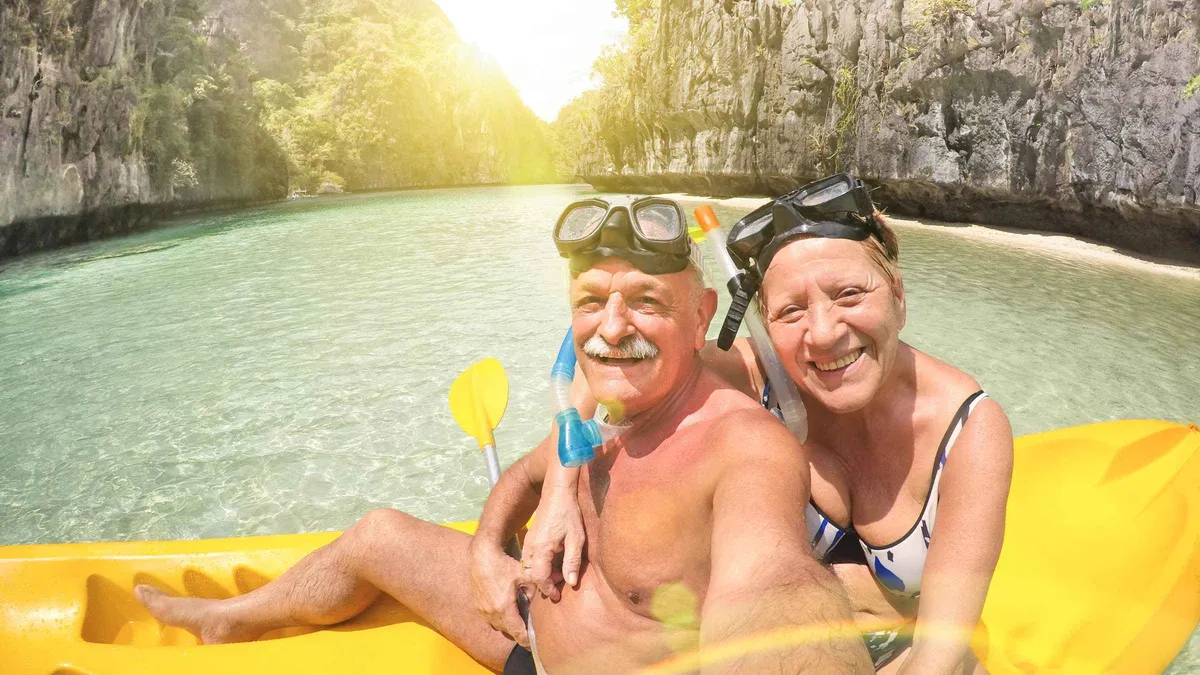Private outrigger boat anchored off Seven Commandos Beach on a private El Nido island hopping tour A, Palawan