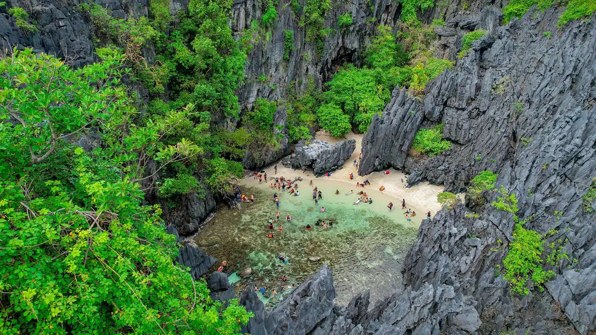 Private bangka anchored off Helicopter Island on a private El Nido island hopping tour C, Palawan, Philippines